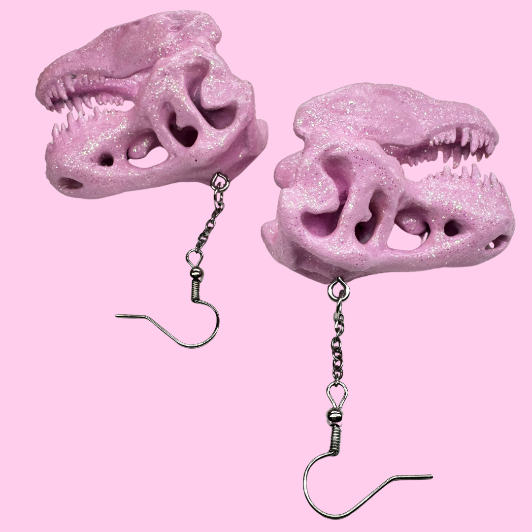Pink Glitter Dinosaur Skull Earrings